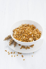 homemade baked muesli in bowl, vertical