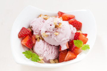 strawberry ice cream in a bowl, top view