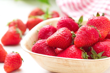 Ripe red strawberries on wooden table