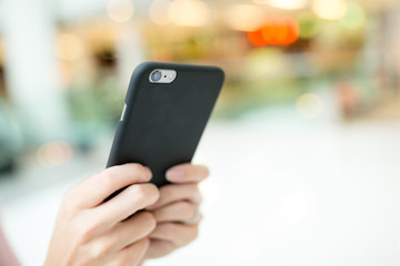 Woman browing internet on cellphone