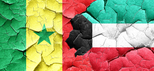 Senegal flag with Kuwait flag on a grunge cracked wall