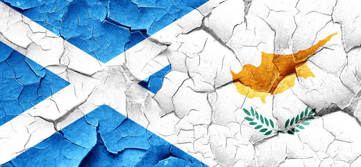 scotland flag with Cyprus flag on a grunge cracked wall
