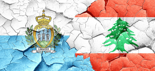 san marino flag with Lebanon flag on a grunge cracked wall