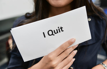 I Quit - Business woman is showing the document for resignation for quit the job