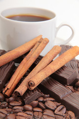 Coffee cup and chocolate on a white background