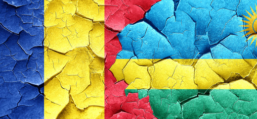 Romania flag with rwanda flag on a grunge cracked wall