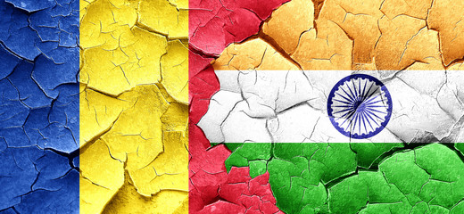 Romania flag with India flag on a grunge cracked wall