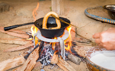 Cooking Sel Roti or Nepali bread