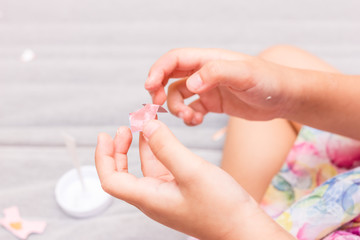 Little girl is cutting the paper