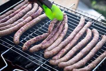 Delicious german sausages on the barbecue grill