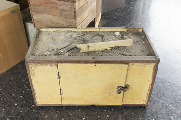 Wooden chest left on the ground.