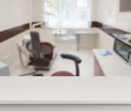 Clean empty table in front of blurred dentist office background