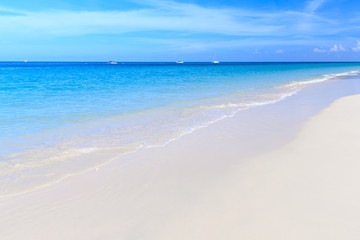 Fototapeta na wymiar tropical white sand beach clear water with blue sky,Phuket Thail