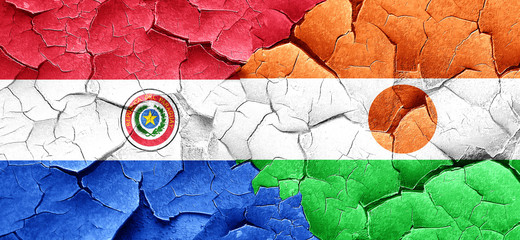 Paraguay flag with Niger flag on a grunge cracked wall