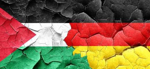 palestine flag with Germany flag on a grunge cracked wall