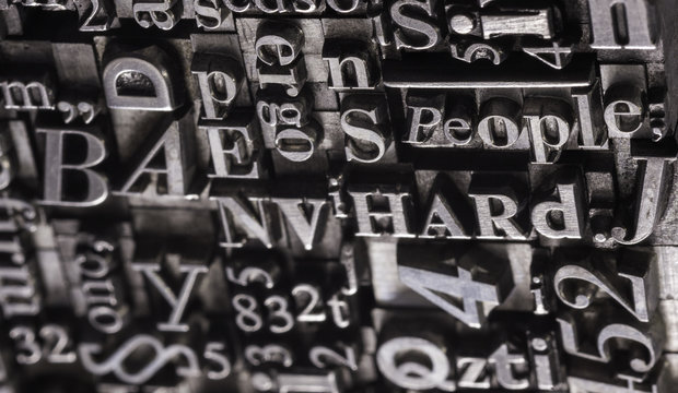 Metal Letterpress Types.
A background from many historic typographical letters in black and white with white background.
