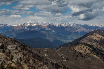 Panoramic view of some snowy peaks of the Dolomites as seen from Monte del Grappa, Italy