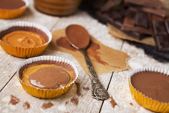 Homemade peanut butter cups on a rustic table
