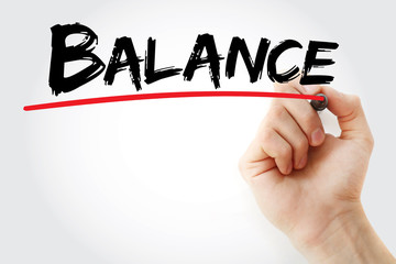 Hand writing BALANCE with marker, health concept