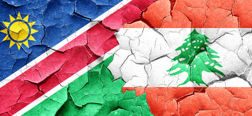 Namibia flag with Lebanon flag on a grunge cracked wall