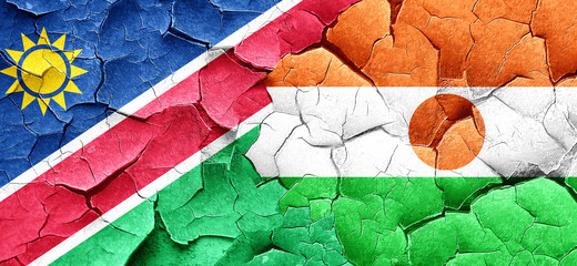 Namibia flag with Niger flag on a grunge cracked wall
