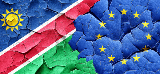 Namibia flag with european union flag on a grunge cracked wall
