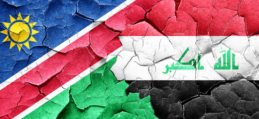 Namibia flag with Iraq flag on a grunge cracked wall