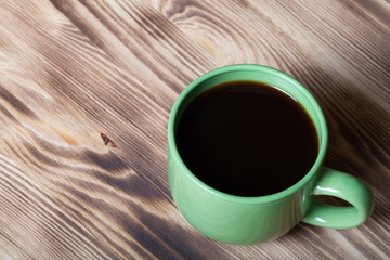 Cup of coffee on new wooden table