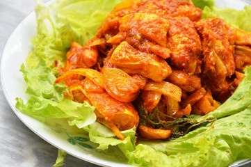 stir fried salmon in curry paste on plate
