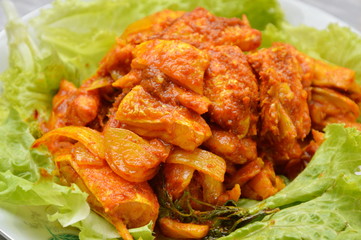 stir fried salmon in curry paste on plate