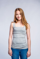 Girl in jeans and singlet, young woman, studio shot