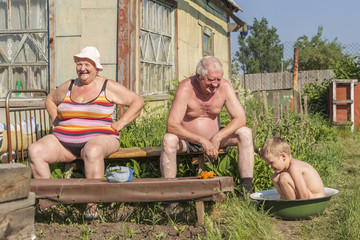 Family summer pastime in the old house with a garden