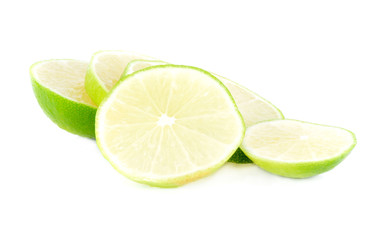 green lemon slices on white background