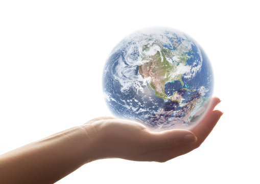 The earth shines in woman's hand. Concepts of save the world, environment etc.