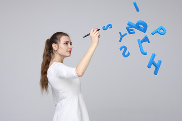 Woman working with a set of letters, writing concept.