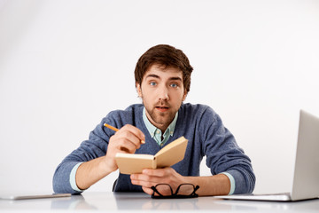 Thoughtful businessman sitting at the office desk