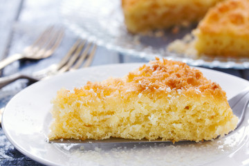 coconut tarte on dish on blue wooden background