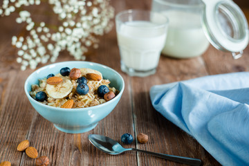 milk porridge breakfast with nuts and berries