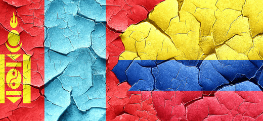 Mongolia flag with Colombia flag on a grunge cracked wall