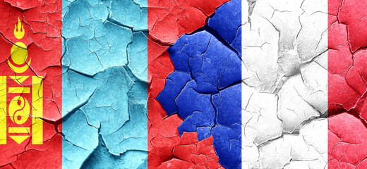 Mongolia flag with France flag on a grunge cracked wall