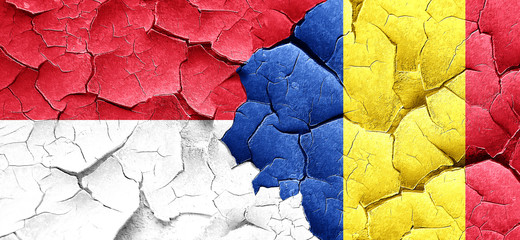 monaco flag with Romania flag on a grunge cracked wall