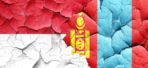 monaco flag with Mongolia flag on a grunge cracked wall