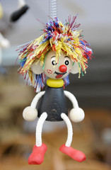 Doll hanging from a spring