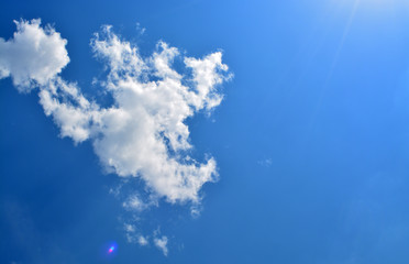 Fototapeta na wymiar Blue sky with clouds and sun light background