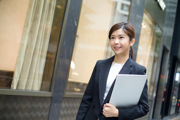 Asian Business woman hold with laptop conputer