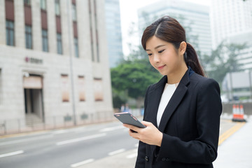 Business woman look at the phone