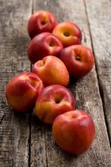 The simple food composition with nectarines on the unique backing closeup 