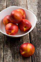 The simple food composition with nectarines on the unique backing closeup 