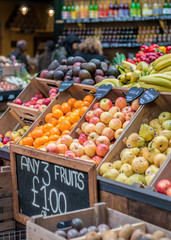 Apples, oranges and other fruits for sale.