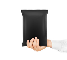 Blank black snack bag mock up hold in hand isolated. Clear grey chips pack mockup. Cookie, candy,...
